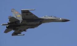 Chinese Fighter Jets Fly Within 50 Feet Of US Spy Plane Near China Chinese Fighter Jets Fly Within 50 Feet Of US Spy Plane Near China