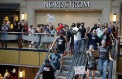 Protesters Storm St. Louis Mall Chanting "No Justice, No Profits" As U2 Cancels Concert